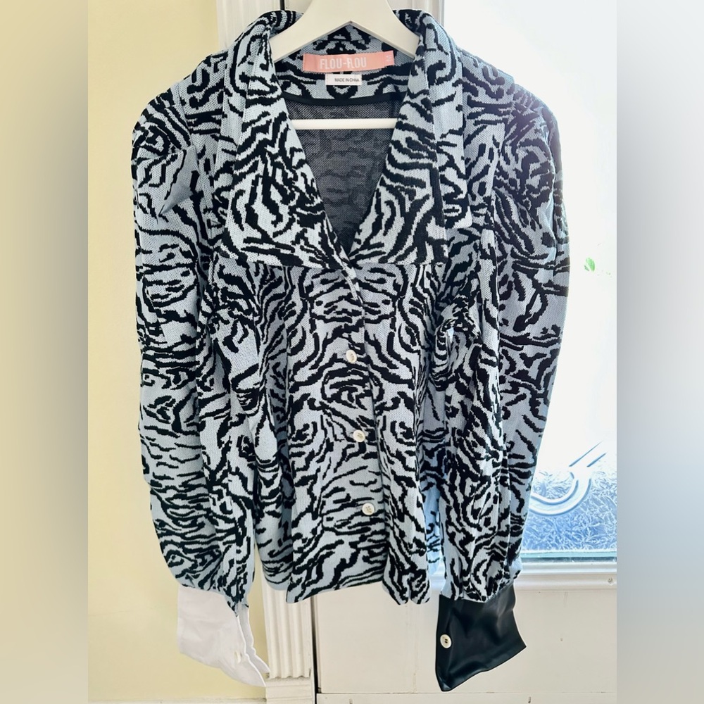 Woman’s sweater, new , designed in NY, made in China